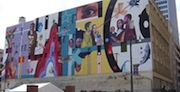 The Toof Building is adorned with a mural by artist Jeff Zimmerman