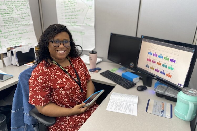 Tyesha Jones, senior client services coordinator at MIFA, works closely with seniors, providing instruction, helping develop content, and continually supporting users each step of the way. She is seen here with a Claris tablet. 