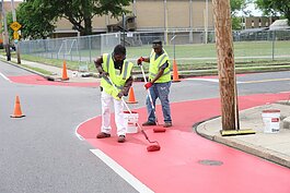 Crew members for the Heights CDC work on traffic calming features to complement the new bioswale construction at Tutwiler and National in 2022. (File photo: Reginald Johnson)