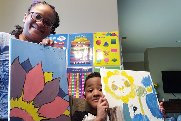 Brijin Shelton and son Xavier Shelton show off the artwork they made together as part of the Gestalt Community Schools' Known, Loved, and Educated self-care and wellness program. (Submitted)