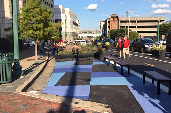 The city targeted Peabody Place for the project due to its excess capacity. For two blocks, a lane of traffic was removed but it’s still similar to what was there before – parking on both sides of the street, one lane eastbound, one lane westbound. T