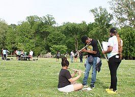 On the greensward at Overton Park, members of the Central High School band take a few extra minutes to practice their parts as the rest of the band wraps up practice behind them in 2021. (File photo: Cole Bradley)